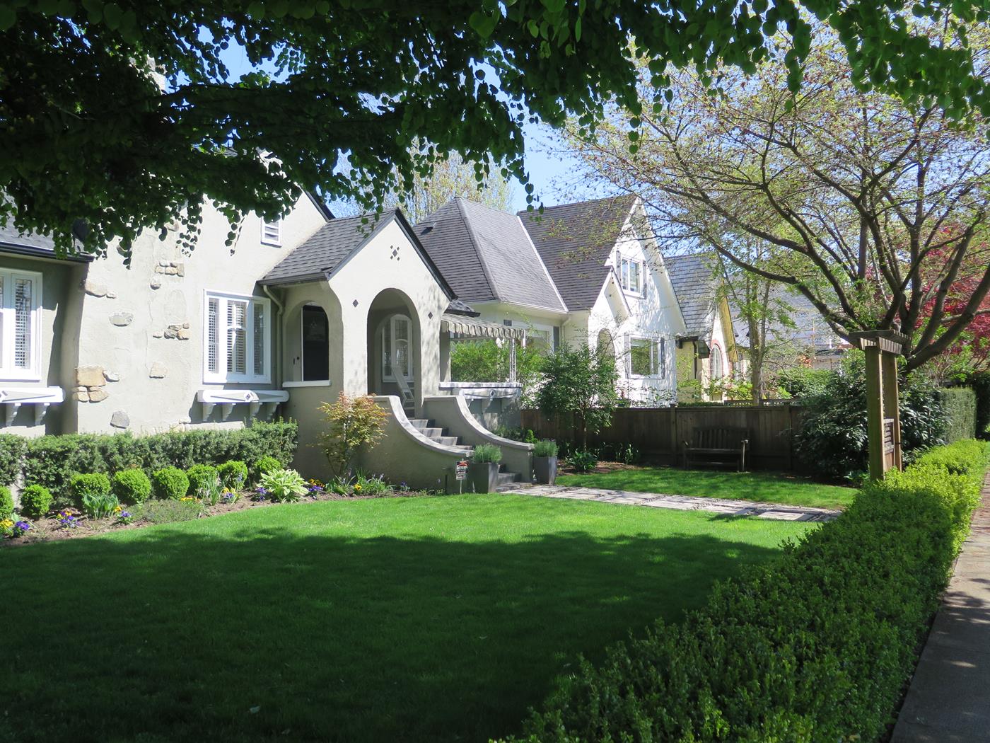 White heritage homes with tidy lawns