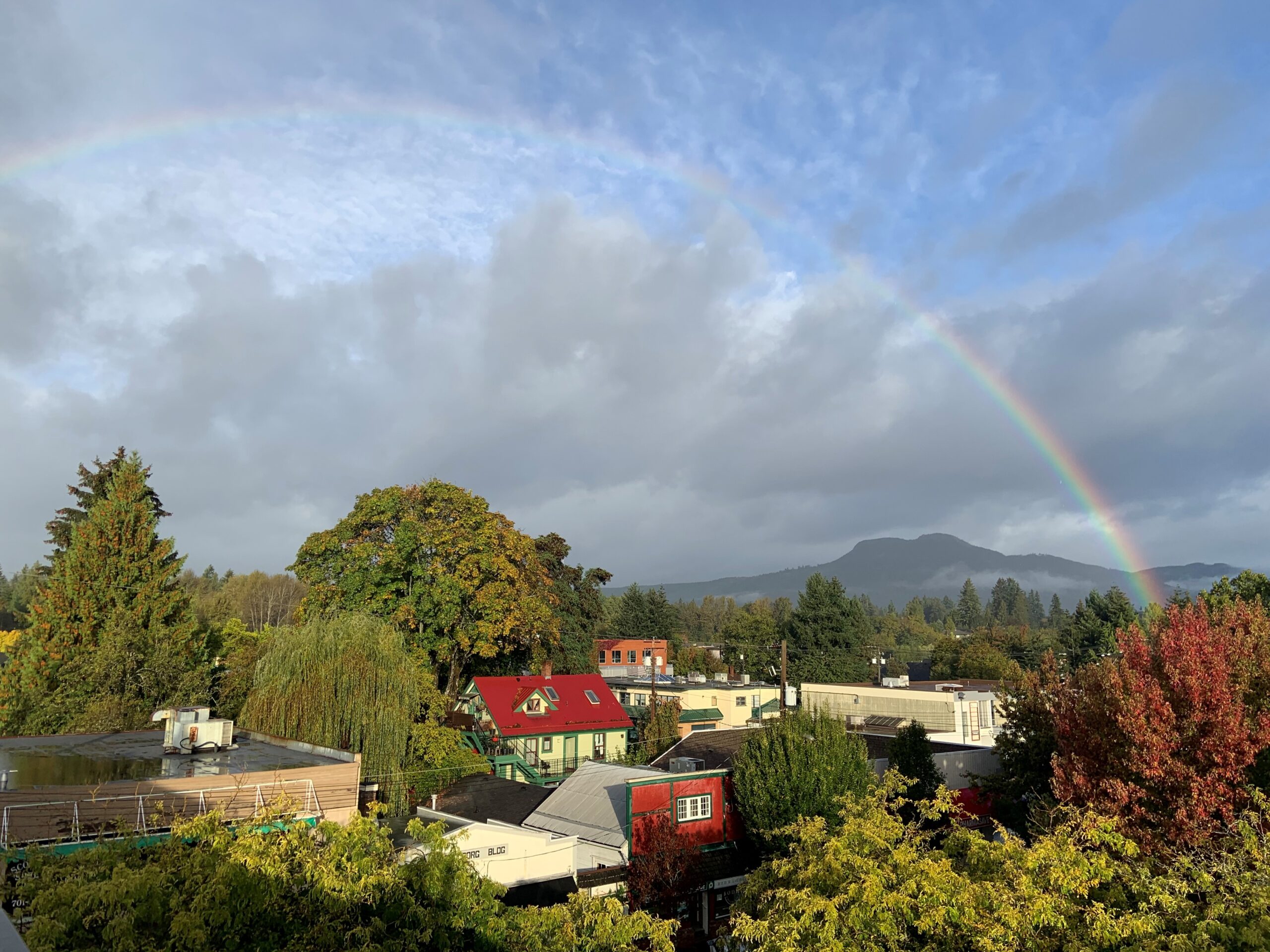 A rainbow stretches over the homes in the City of Duncan