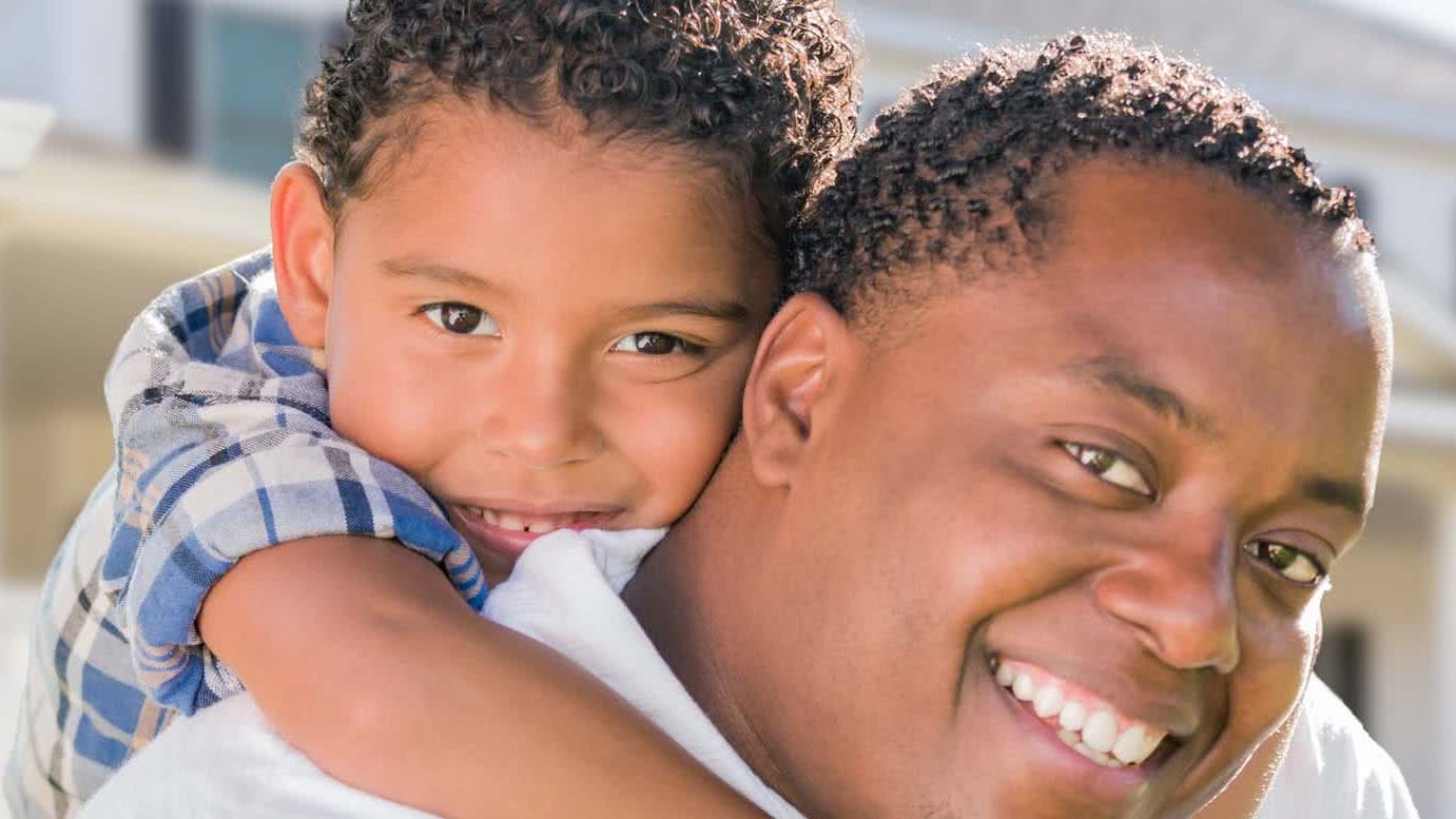 Father and son with sold home